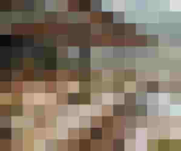 Terrace of a modern wellness hotel with mountain views and infinity pool